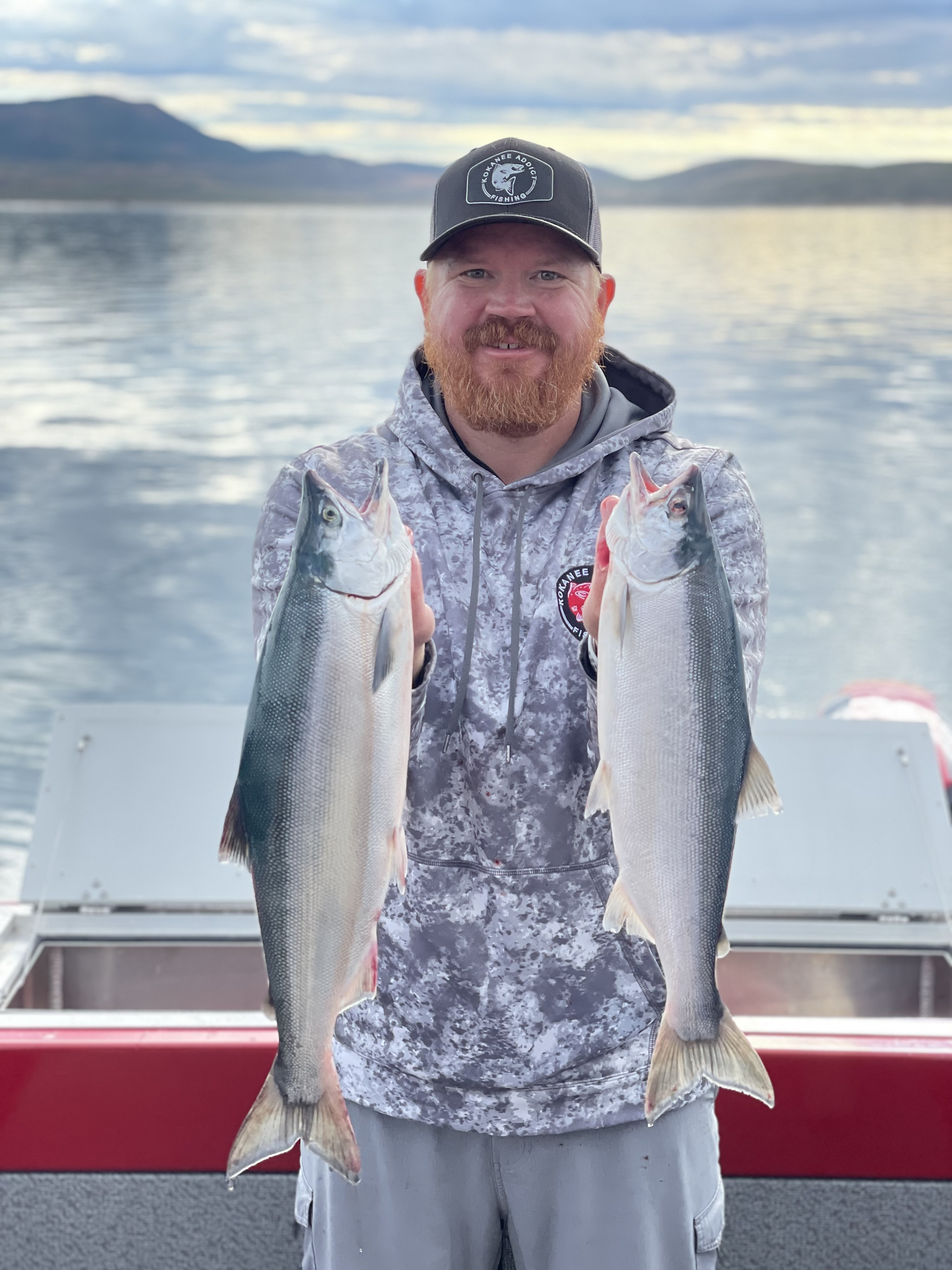 Matt Pierce holding two kokanee salmon